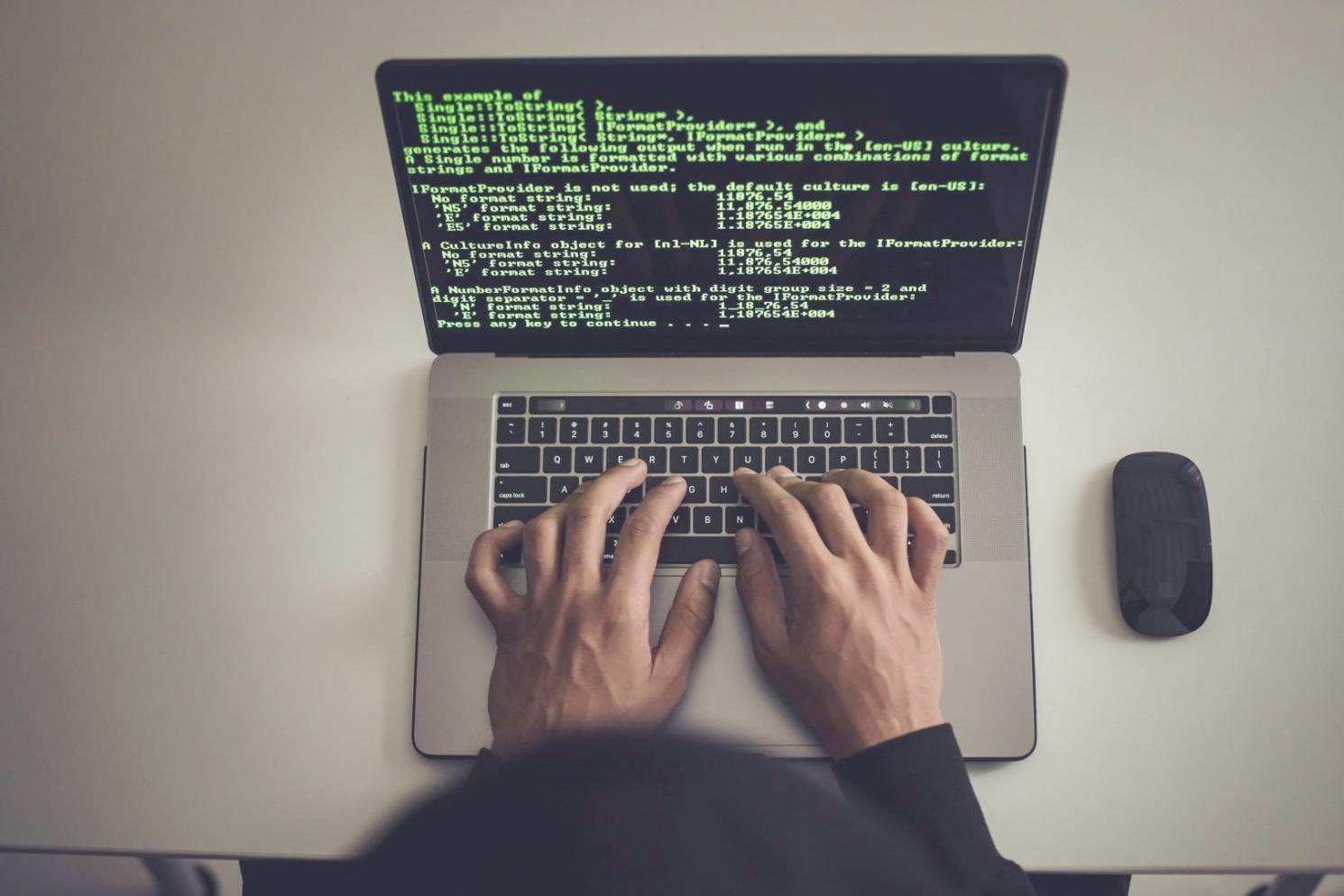 Software testing environment showing multiple screens with debugging tools and code analysis